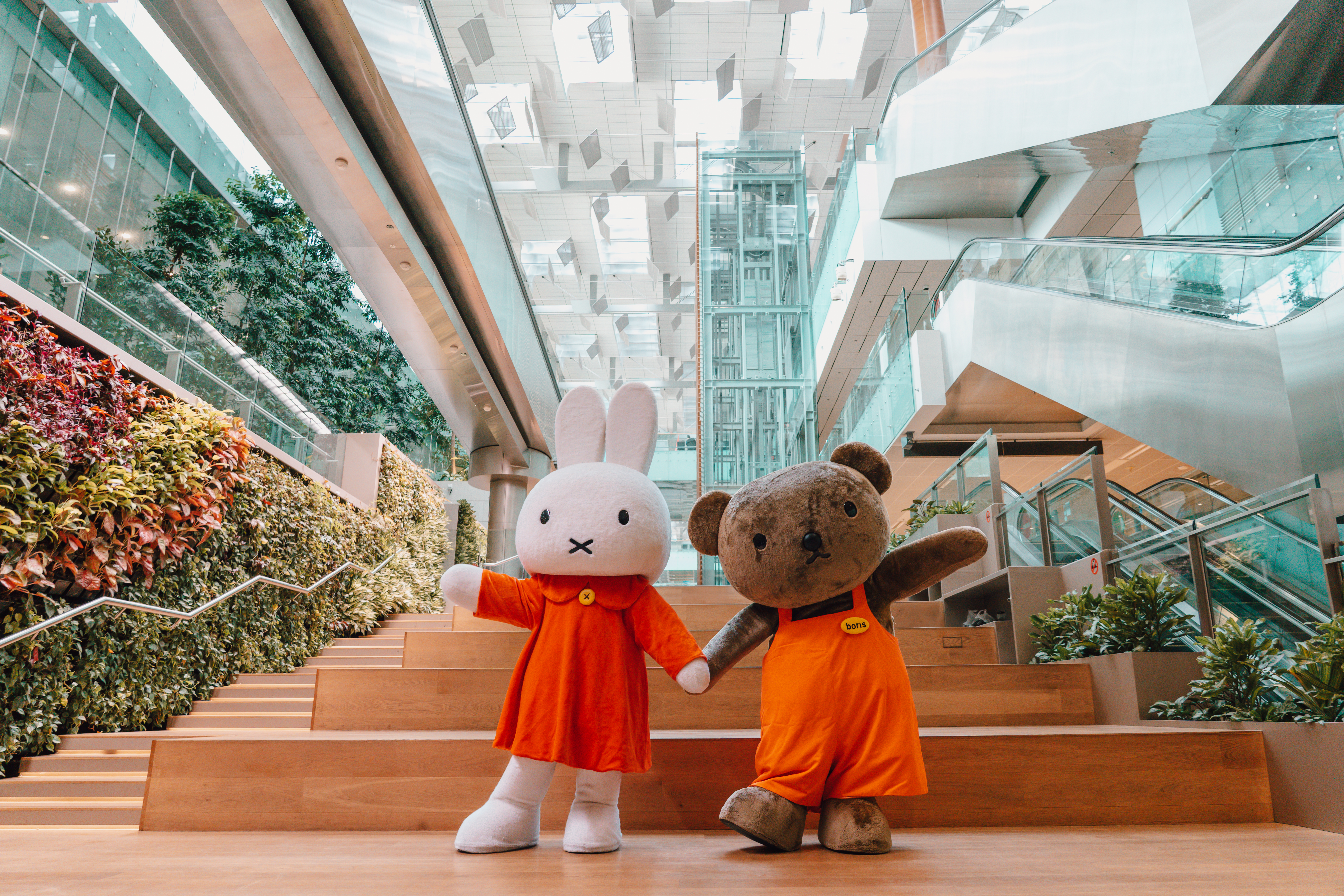 Kids playing under the snow at Hello Kitty Festive Wonderland at Changi Airport Terminal 3 