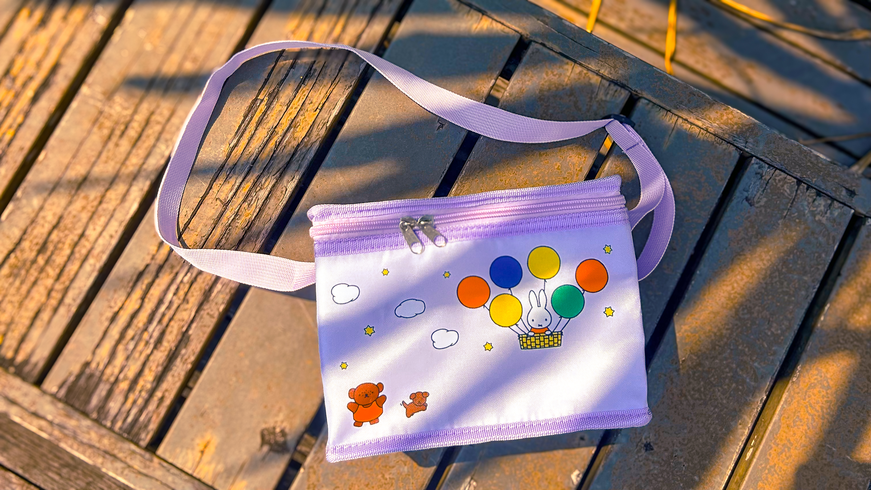 Green, blue and lilac Puffy Bags with Hello Kitty and Friends bag charms at Changi Airport 