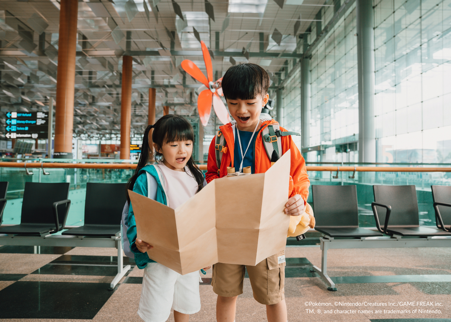 children looking at map at changi airport
