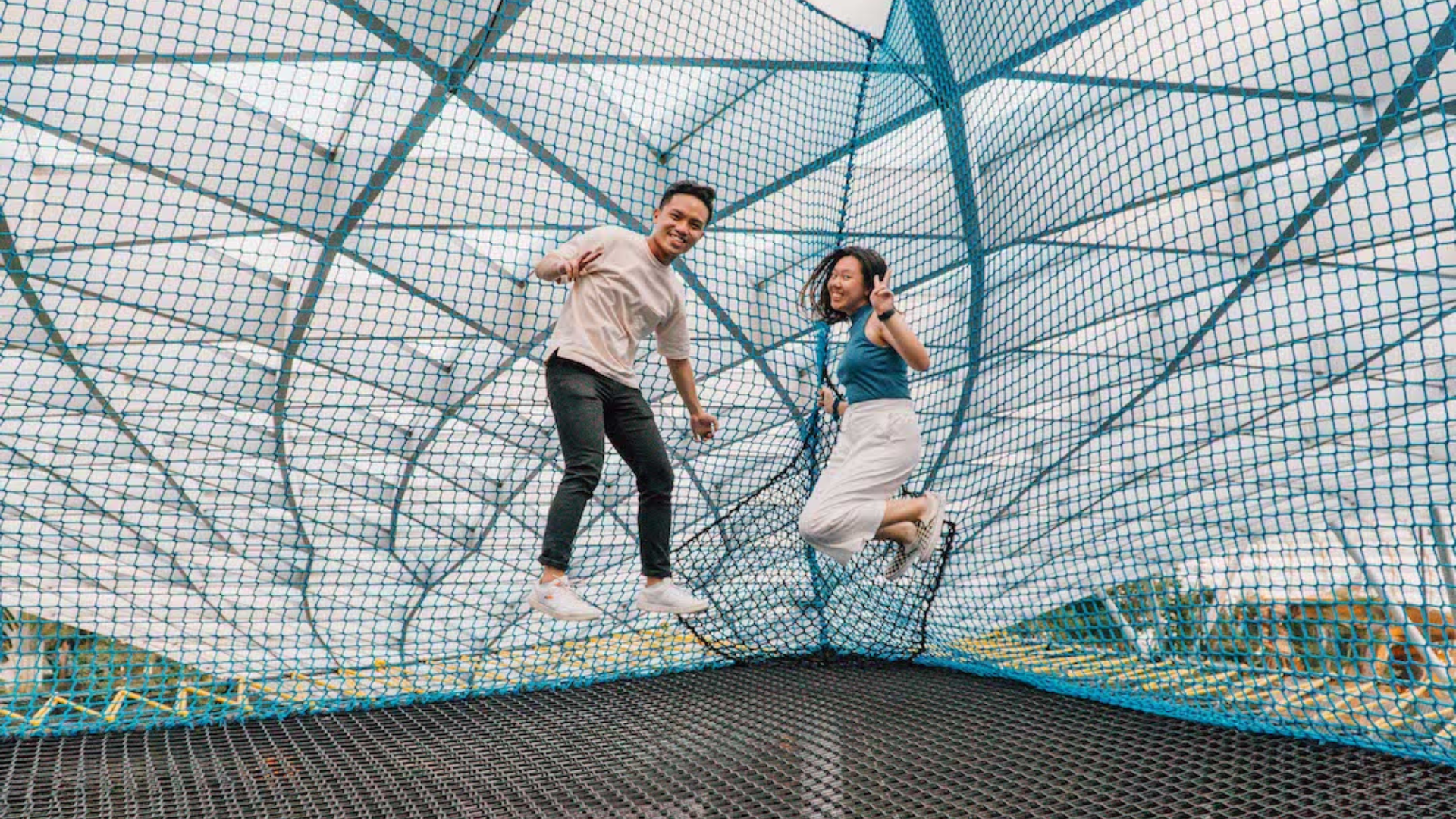 Adults jumping at the Bouncing Net