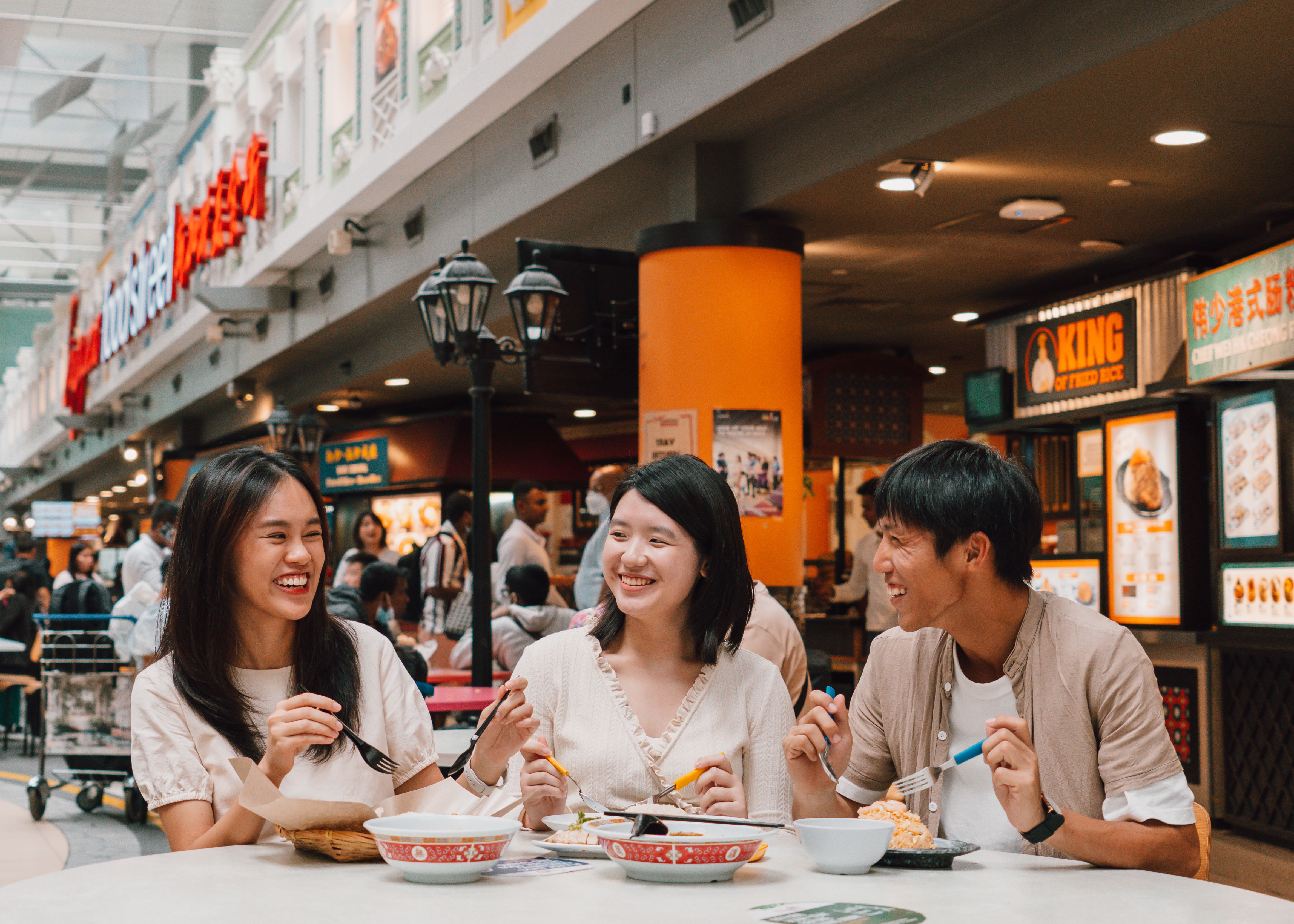 friends dining at terminal 3 transit food street