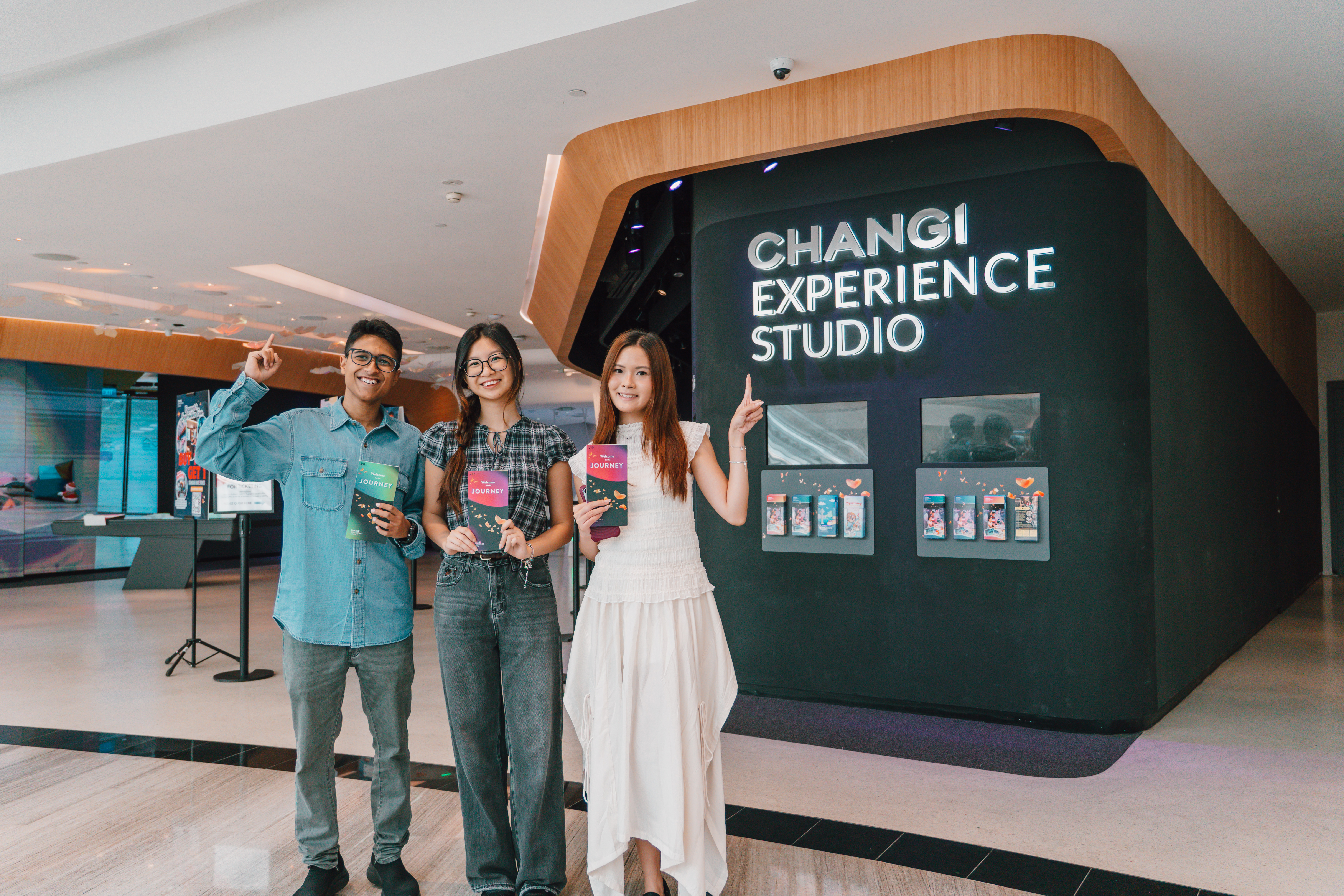 three friends ready for adventure outside changi experience studio