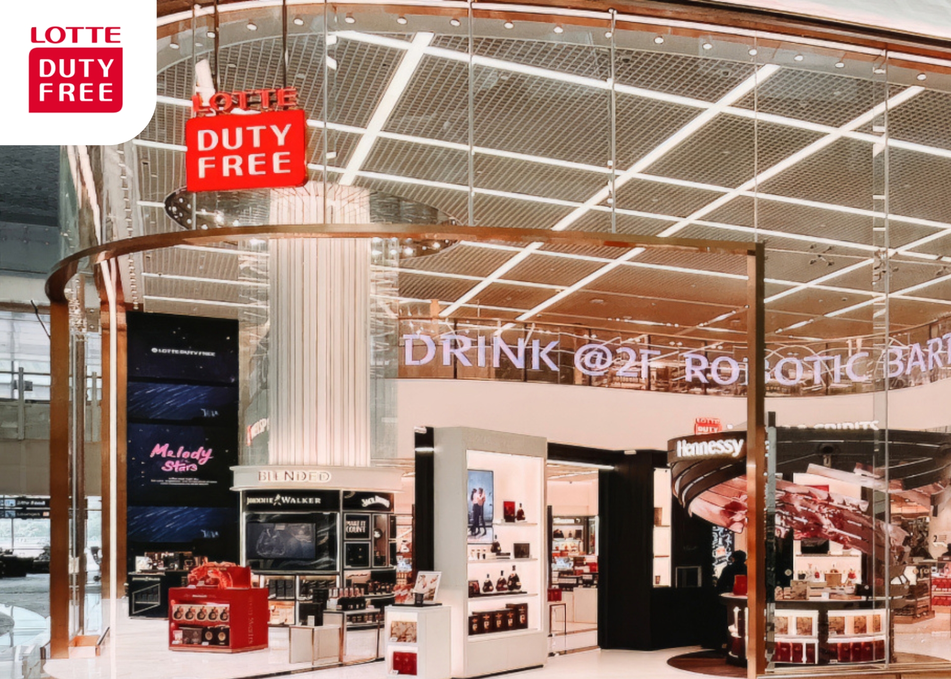 Lotte Duty Free premium spirits on display shelves. 
