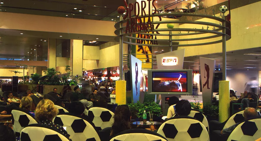 Thematic lounges, such as a news hub, sports arena, and movie theatre in transit area Changi Airport